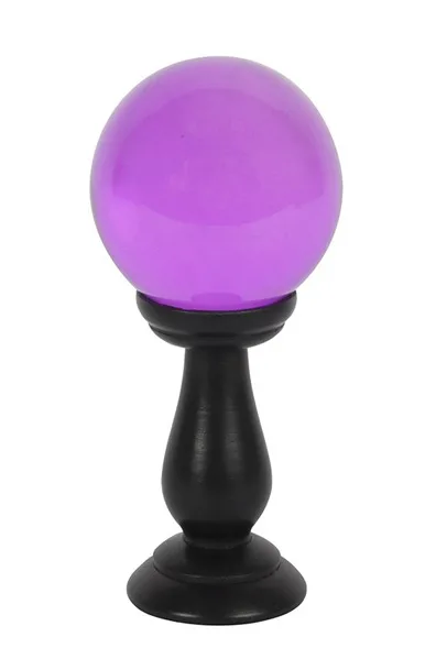 Purple crystal ball on stand